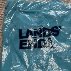 Brand new, never worn and still in the plastic shipping plastic. Mesh s/slv polo